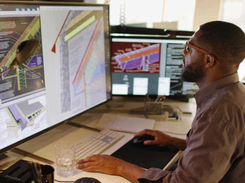 StarterStudio.org > man working at desk on innovative project